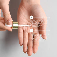 Load image into Gallery viewer, Hand applying serum to cuticles with text instructions on a neutral background
