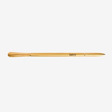 Gold makeup brush on a white background