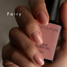 Load image into Gallery viewer, Hand with pink nail polish holding a bottle of &#39;Fairy&#39; nail gel.