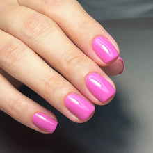 Charger l'image dans la galerie, Hand with pink nail polish on a neutral background