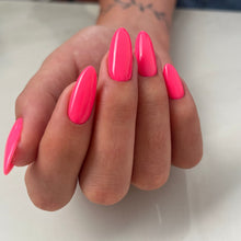 Charger l'image dans la galerie, Hand with bright pink nails on a white surface