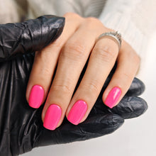 Charger l'image dans la galerie, Hand with pink nails wearing a black glove on a white background