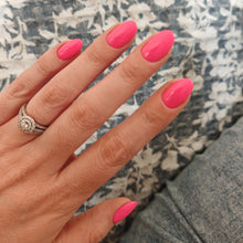 Charger l'image dans la galerie, Hand with pink nails and a ring on a textured surface