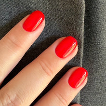 Charger l'image dans la galerie, Hand with red nail polish on a dark background
