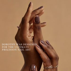 Close-up of hands with polished nails on a beige background with text about nail art.