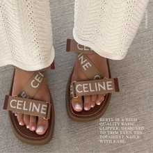 Charger l&#39;image dans la galerie, Brown Celine sandals worn with white pants on a gray surface.