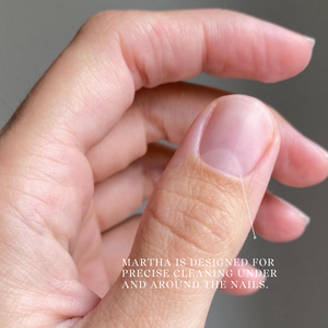 Close-up of a hand with a focus on the nail area, text indicating product use.