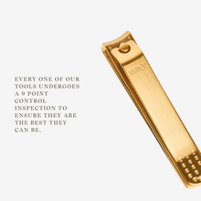 Charger l&#39;image dans la galerie, Gold nail clipper on a white background with text about quality control.