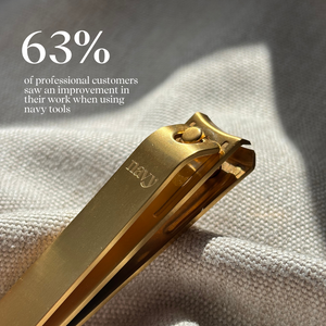 Gold nail clipper on a textured fabric background with text about customer feedback.