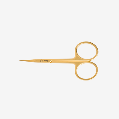 Pair of gold cuticle  scissors on a white background