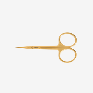 Pair of gold cuticle  scissors on a white background