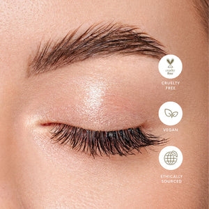 Close-up of a person's eye with long, dark eyelashes, featuring cruelty-free, vegan, and ethically sourced icons.