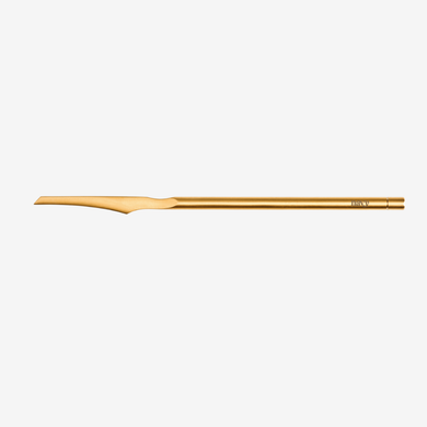 Gold pedicure knife on a white background
