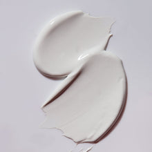 Load image into Gallery viewer, Two swatches of white cream on a light gray background