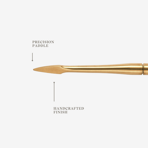 Gold precision paddle with text on a white background