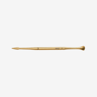 Gold manicure tool  on a white background