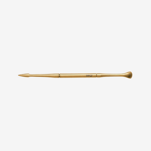 Gold manicure tool  on a white background