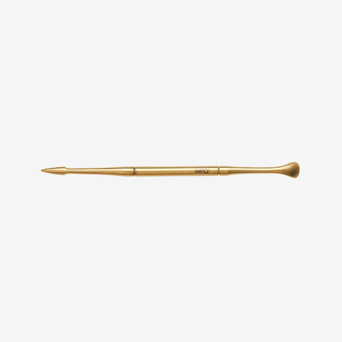 Gold manicure tool  on a white background