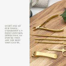 Load image into Gallery viewer, Set of gold nail tools on a wooden surface with text about tool inspection.