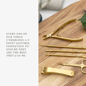 Set of gold nail tools on a wooden surface with text about tool inspection.