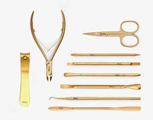 Load image into Gallery viewer, Set of gold beauty tools including scissors, tweezers, and pliers on a white background