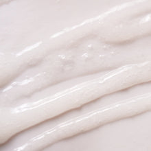 Charger l'image dans la galerie, Close-up of smooth, white cream on a light background